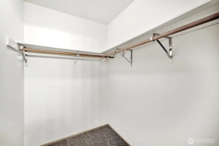Primary walk in closet. Primary walk in closet.