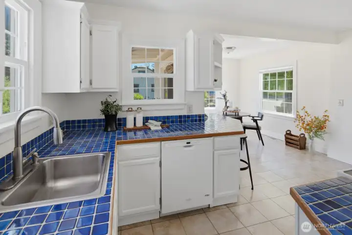 Kitchen flows seamlessly into a large dining area Kitchen flows seamlessly into a large dining area