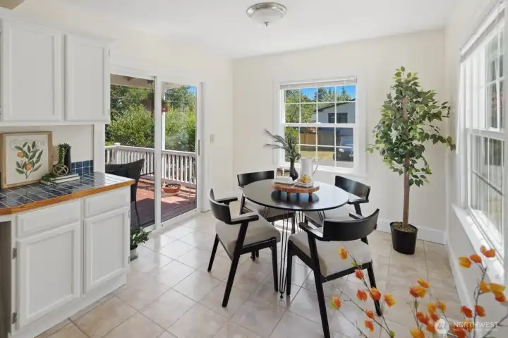 Generous dining area with slider to the expansive deck, perfect for indoor-outdoor entertaining Generous dining area with slider to the expansive deck, perfect for indoor-outdoor entertaining