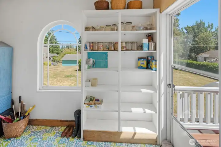 Large Pantry/Storage room by kitchen. Includes another access to deck Large Pantry/Storage room by kitchen. Includes another access to deck