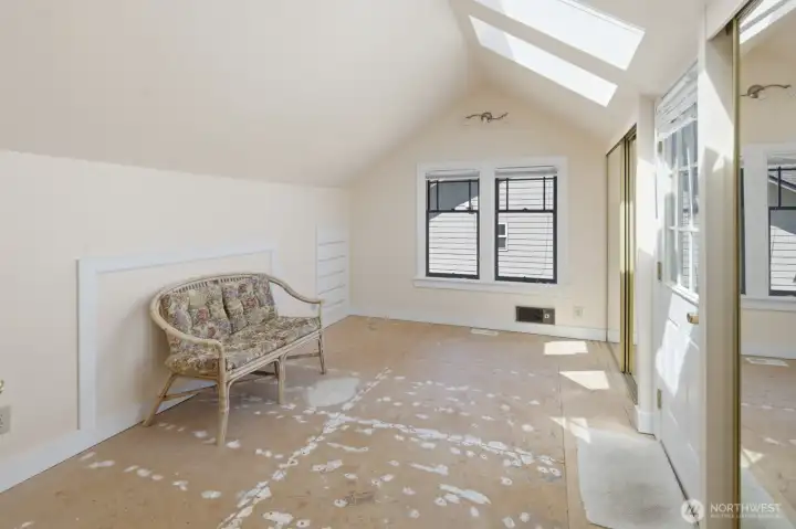 Generous upstairs bedroom featuring tall ceilings, skylights, built-in storage and an incredible roof-top deck Generous upstairs bedroom featuring tall ceilings, skylights, built-in storage and an incredible roof-top deck