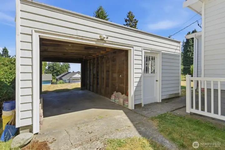 The detached carport provides convenient off-street parking with access from either the main road or the alley The detached carport provides convenient off-street parking with access from either the main road or the alley
