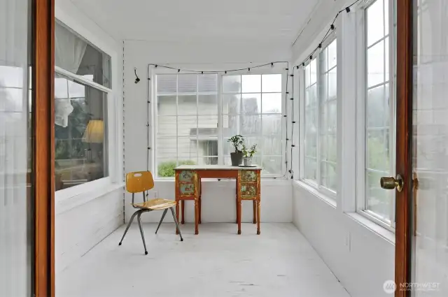 The porch with wrap around windows- lots of potential to add this sq footage to the living space.