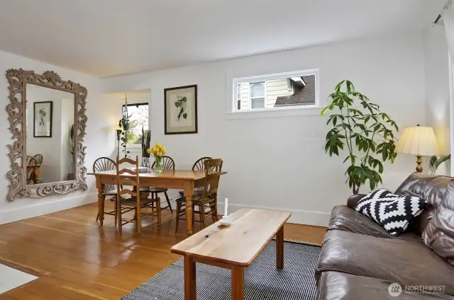 Main level unit with a large living room/dining space, with fir floors throughout.