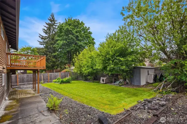 Newer back deck and gorgeous lawn.