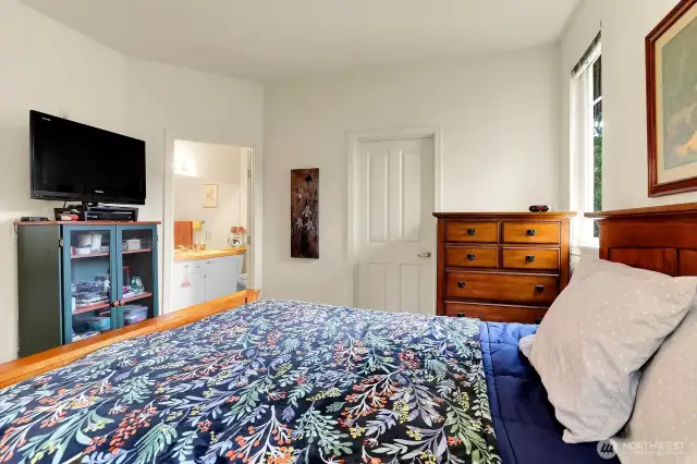 Primary bedroom with with bathroom and walk in closet.