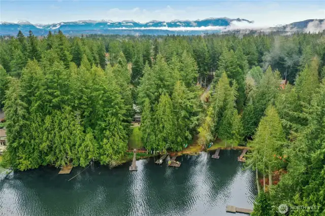 Tucked beneath a canopy of evergreens, this Sammamish lakefront property features 50 feet of private waterfront on tranquil Beaver Lake, an ideal setting for paddleboarding, kayaking, or simply enjoying nature in complete privacy.