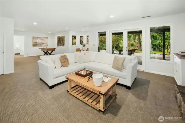 This flexible lower-level retreat offers space to play, relax, or entertain, complete with a gorgeous 3/4 bathroom, bedroom and flex room (think office, workout space, extra storage) and views of the lakeside setting. Walls of windows bring the outside in. Plumbed for an efficiency kitchen or wet bar, too!
