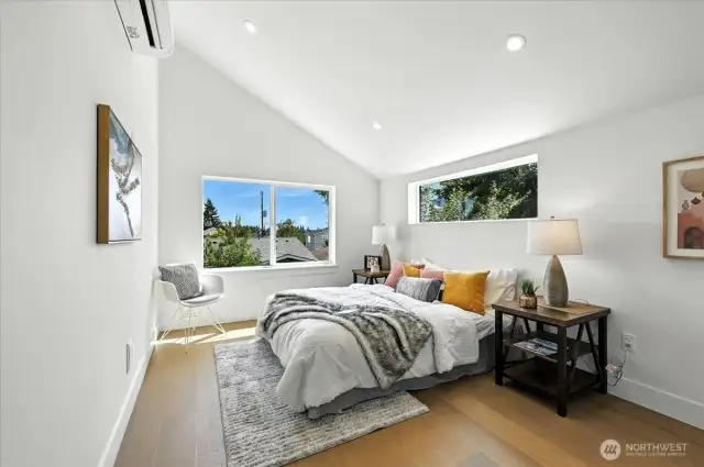 Primary Suite with hardwoods and vaulted ceilings