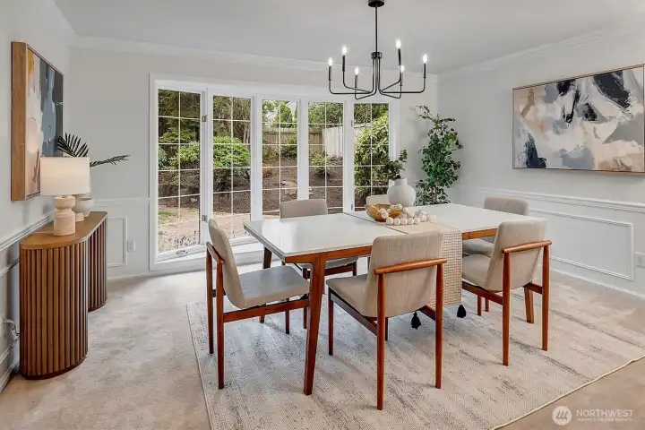 Formal Living room with floor to ceiling windows, offering light from the rear yard