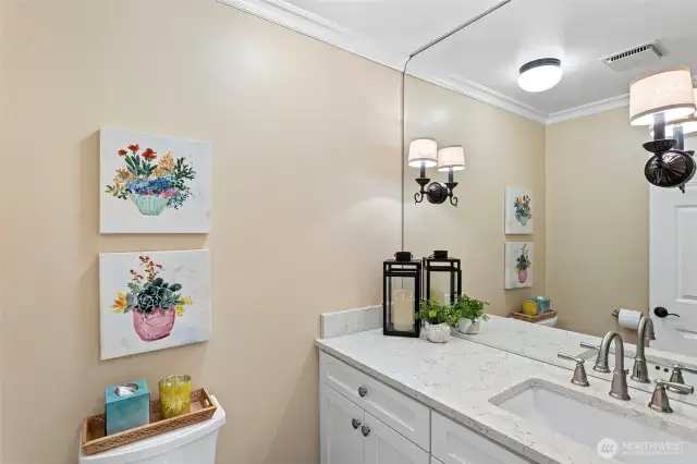 This powder room is conveniently located on the main level for guests and entertaining.