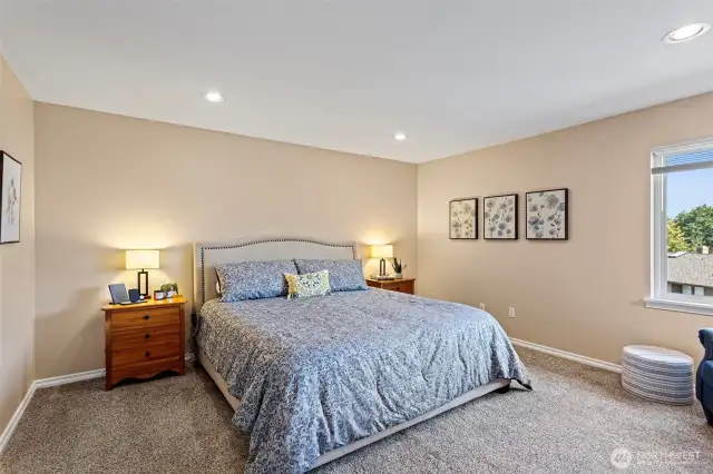 Catch peek views of the golf course from the primary bedroom.