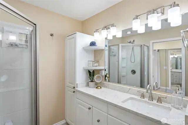 The primary bedroom boasts upgraded   vanity shower and fixtures!