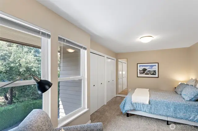 The second bedroom also boasts a wall of closets and plenty of room to keep everything tidy and well organized.