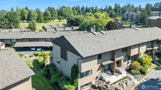 Peek views of the golf course and first fairway are visible from the upper rooms in the townhome.