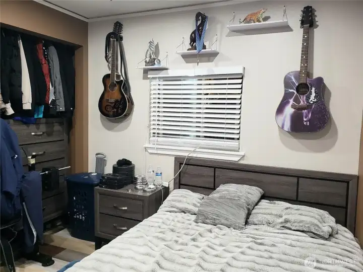 A different View of the Huge Second Bedroom Showing New Paint, Trim, 1 inch Blinds and Vinyl Plank Flooring.