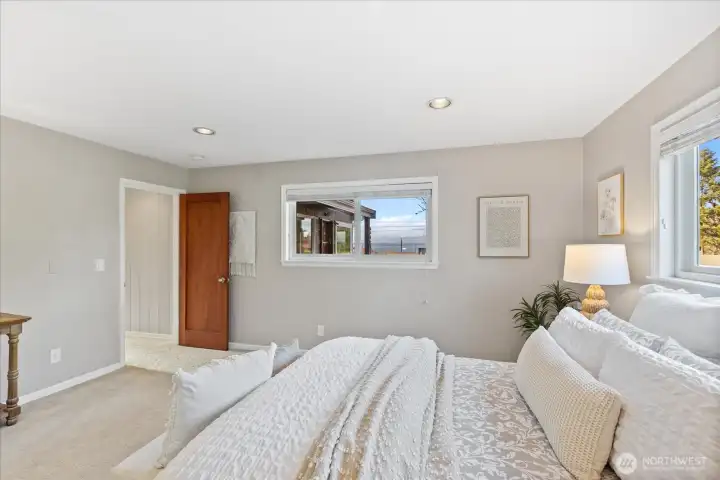 Primary bedroom with Sound and mountain views
