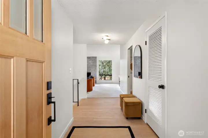 Enter through a covered front porch, with a new solid fir wood door that leads to a formal entry with guest coat closet and space to kick off your shoes.