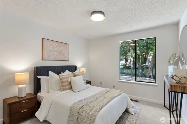 2nd main floor bedroom features large double closet and wall-to-wall carpeting.  It faces east overlooking the private front yard.