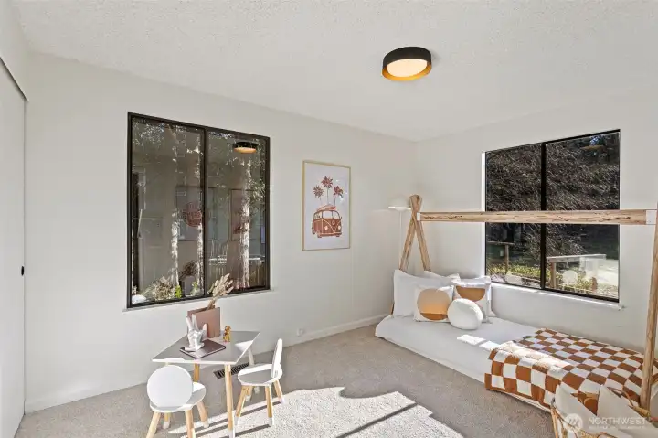 3rd main floor bedroom features large double closet and wall-to-wall carpeting.  It faces south and east overlooking front yard and neighboring park.