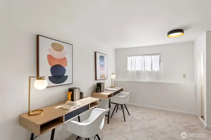 Lower level bedroom is freshly painted with new wall-to-wall carpet.