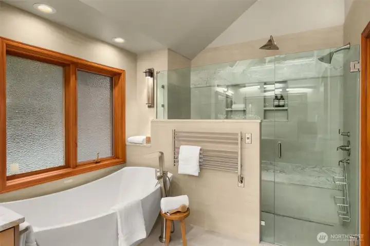 Enjoy a soak in deep tub with bubbles and multiple opulent shower choices