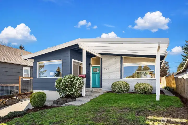 Beautifully updated midcentury home on a spacious flat lot with alley access in the back.