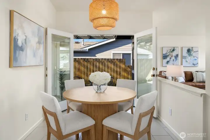 The dining area has french doors which open to a spacious covered patio.