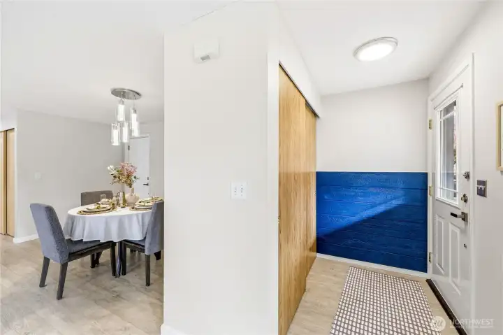 On the right is the entrance which has a coat closet. The left side shows the dining area.