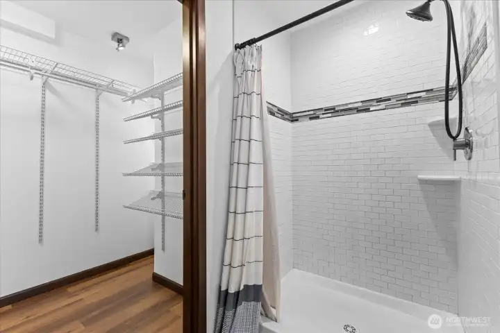 Shower and a large walk-in closet.