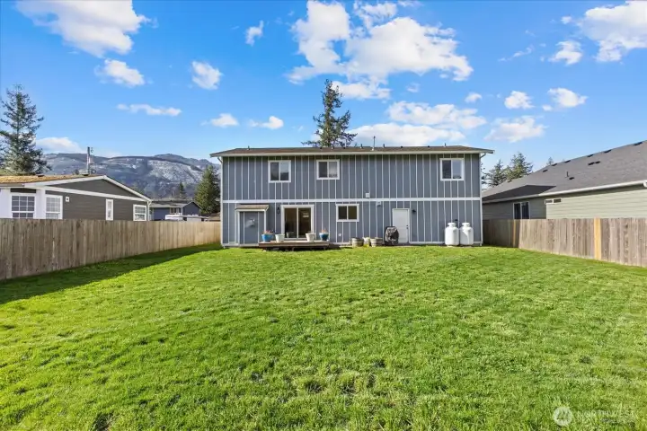 Fully fenced, large flat back yard.