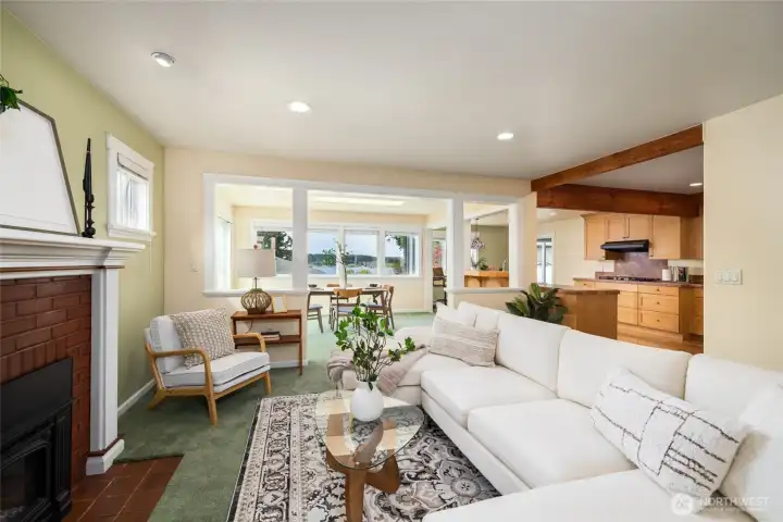 View from living room to dining room and kitchen. Access to deck off of the dining room.