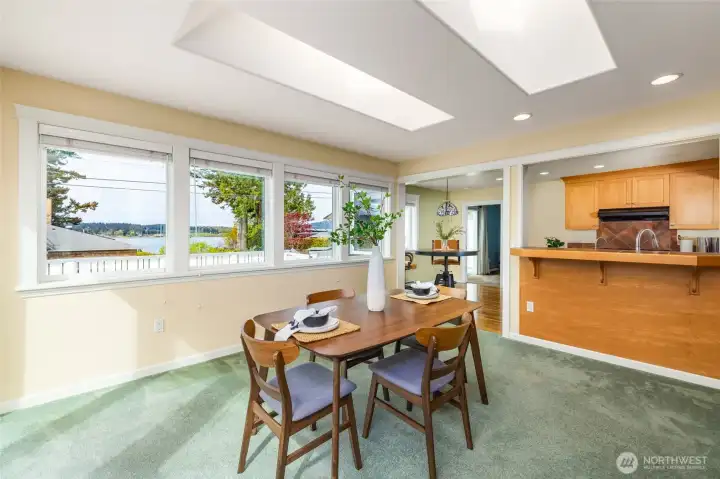Skylights in dining area let in more natural light.