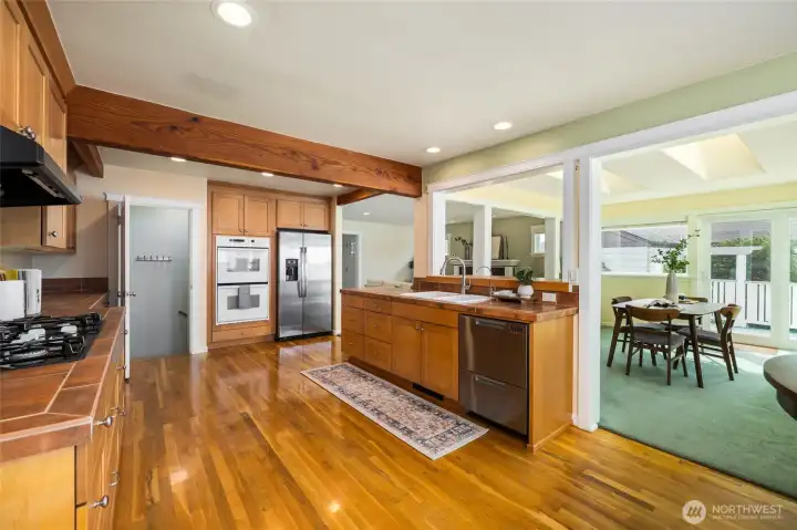 Another view of the kitchen - new two drawer dishwasher is at the end of the counter with the sink.