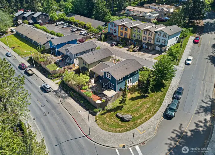 Ideally positioned on a prominent corner lot, this charming blue craftsman stands out among the neighborhood with its bold exterior and beautifully landscaped surroundings. The aerial perspective reveals the private fenced backyard, attached garage, and easy walkability to downtown Friday Harbor.
