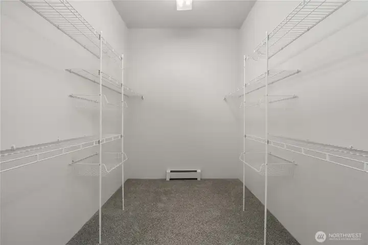 Primary walk-in closet. Primary walk-in closet.
