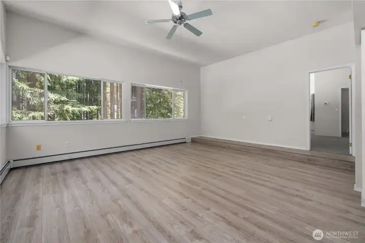 Family room is open to the kitchen and adjacent to the primary bedroom. Family room is open to the kitchen and adjacent to the primary bedroom.