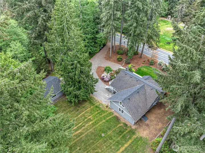 Lots of driveway parking in addition to the attached and detached garages.  Lawns in front and back yard.