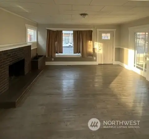 Livingroom-cozy fireplace, plenty of natural light