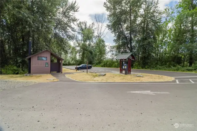 Trailhead parking and bathroom across street from lake.