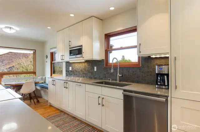 Remodeled Euro-style kitchen with high-end appliances, including Miele induction range.