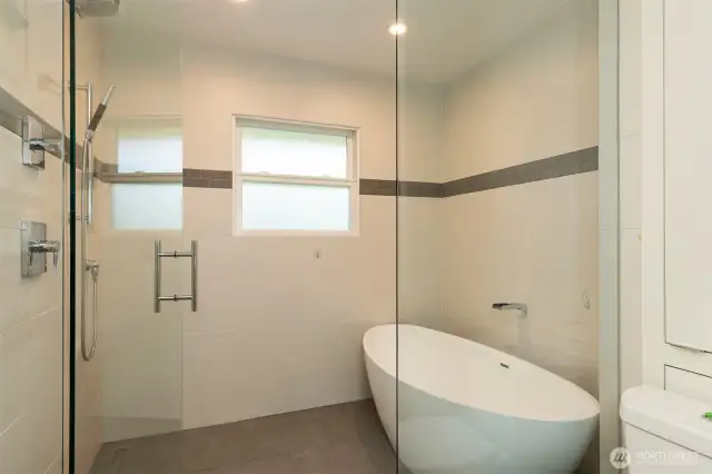 Luxuriously updated main bath with heated floors and soaking tub.