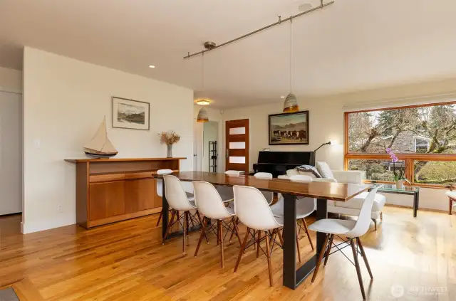 Open living/dining area with views and beautiful custom fireplace.