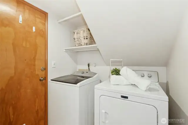 Utility room with an access door to the garage.