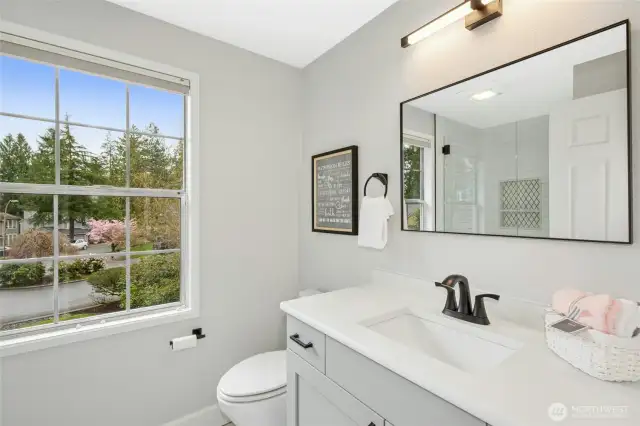 Freshly updated primary bathroom with an oversized shower.