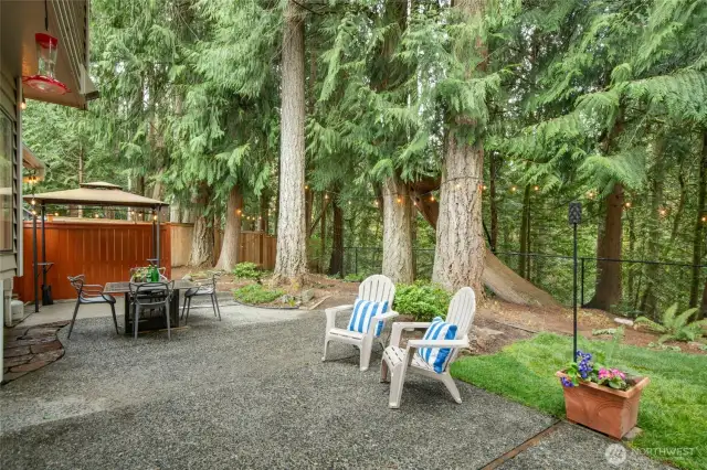 A covered area for entertaining at the end of the patio.