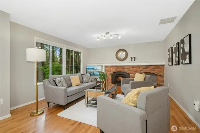 Cozy family room overlooks the kitchen and eating areas with a private backyard outlook.