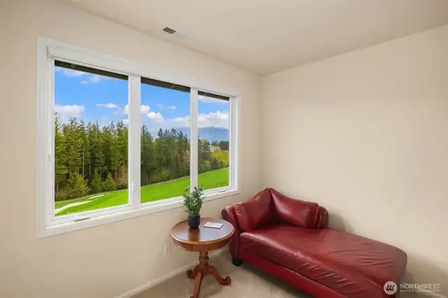 4th upstairs bedroom looking out to the golf course & mountains.
