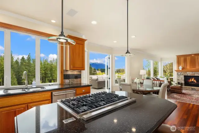 The casual great is spanned by view windows & French doors opening to the deck.