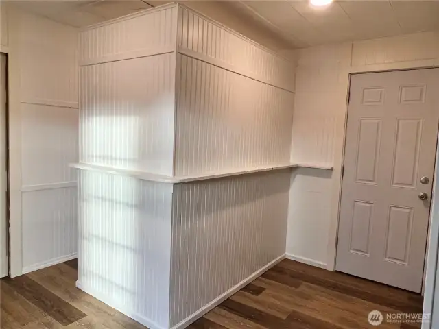 Big storage closet behind this wall. Great for games, linens, anything.